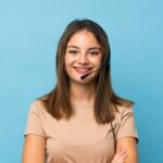young brunette girl isolated working with headset